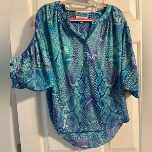 Medium weight blouse. I’m a size 6 and 5’4”.